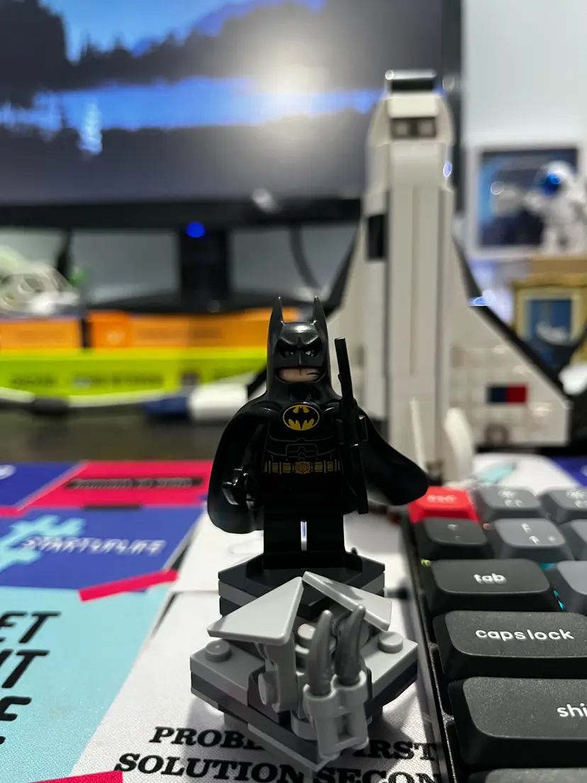 Lego Batman minifigure on keyboard with grey structure